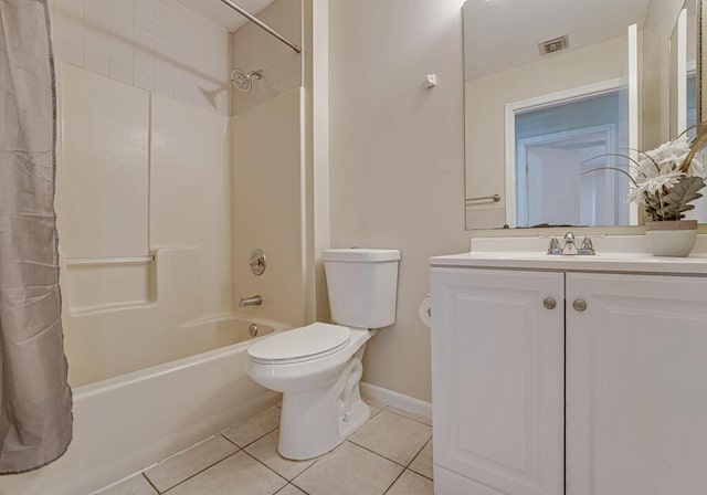 full bathroom featuring tile patterned floors, toilet, shower / bath combo with shower curtain, and vanity