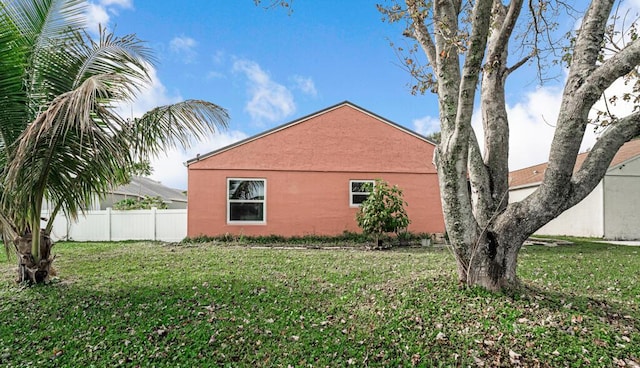 view of property exterior featuring a yard