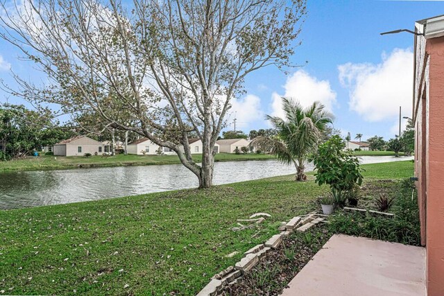 view of front of property with a garage and a front yard