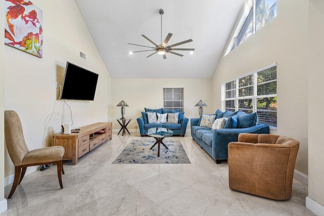 living room with ceiling fan and high vaulted ceiling