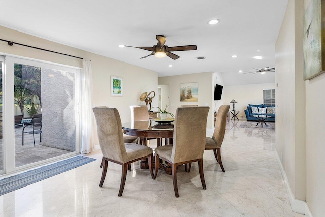 dining space featuring ceiling fan