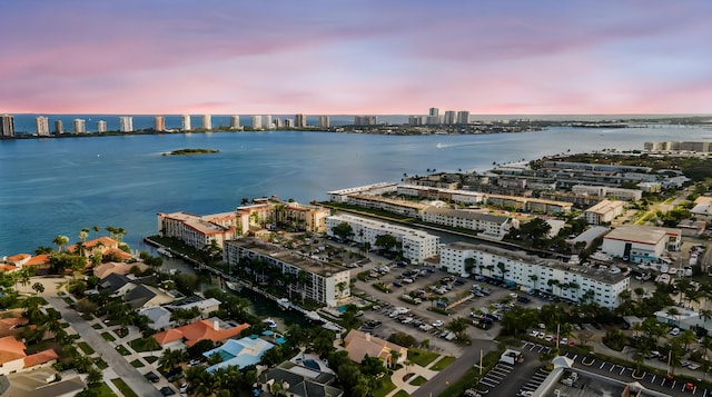 aerial view at dusk with a water view