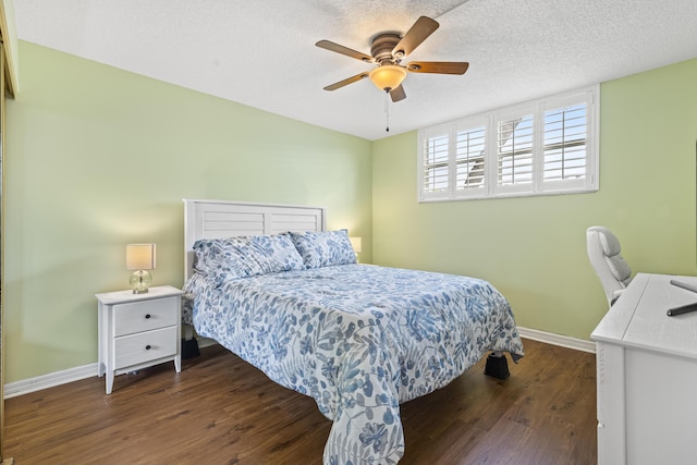 bedroom featuring a textured ceiling, ceiling fan, and dark wood-type flooring