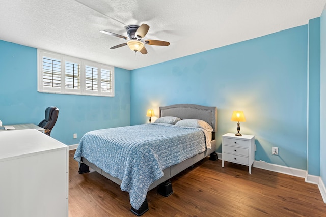 bedroom featuring ceiling fan and dark wood-type flooring