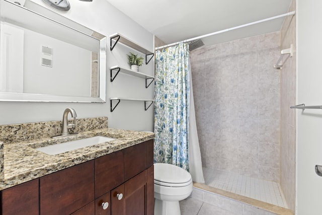 bathroom featuring tile patterned floors, a shower with curtain, vanity, and toilet