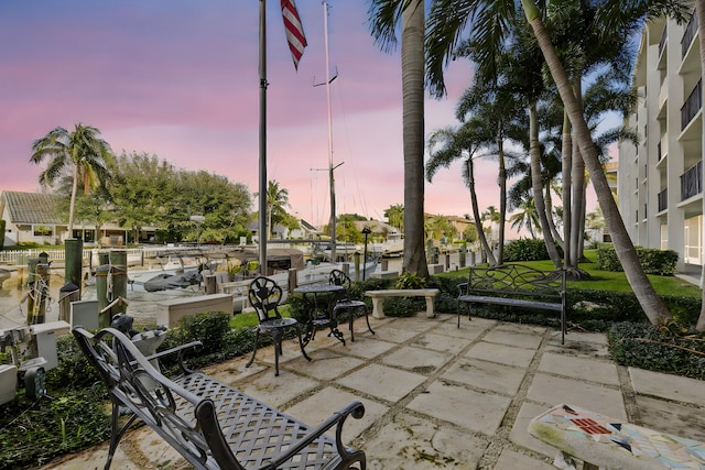 view of patio terrace at dusk