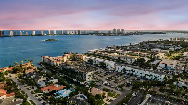 aerial view at dusk with a water view