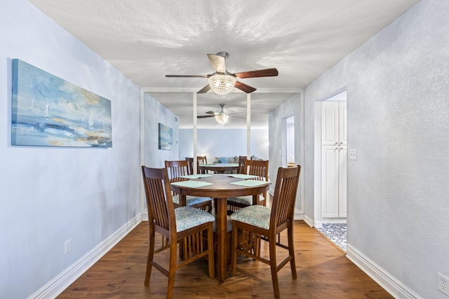 dining area featuring hardwood / wood-style floors and ceiling fan