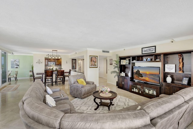 living room with ornamental molding and an inviting chandelier