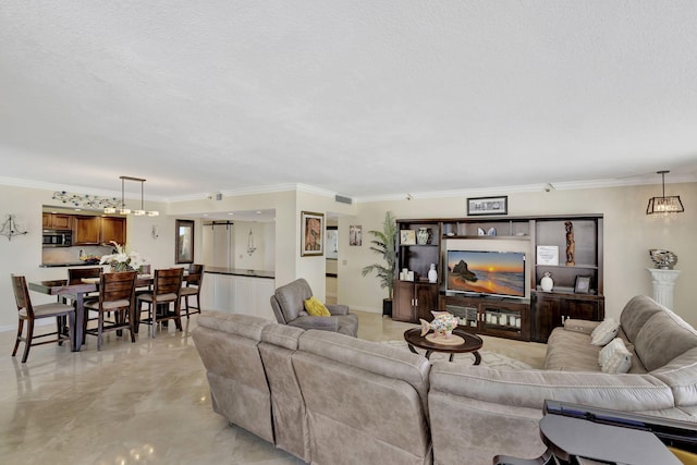 living room with a textured ceiling and crown molding