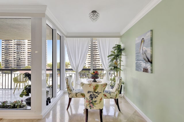 dining space featuring crown molding