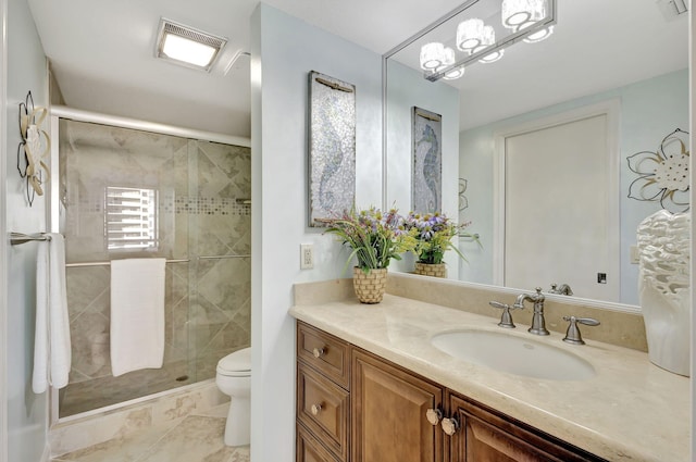 bathroom with tile patterned flooring, vanity, an enclosed shower, and toilet