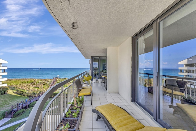 balcony featuring a water view