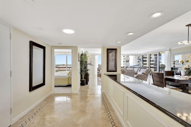 kitchen featuring white cabinets and decorative light fixtures