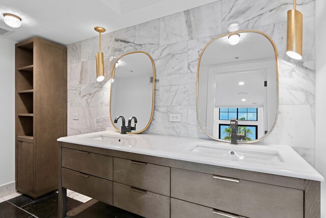 bathroom with vanity, tile patterned floors, and tile walls