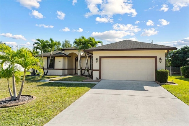 ranch-style home with a front yard and a garage