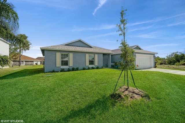 single story home featuring a garage and a front lawn