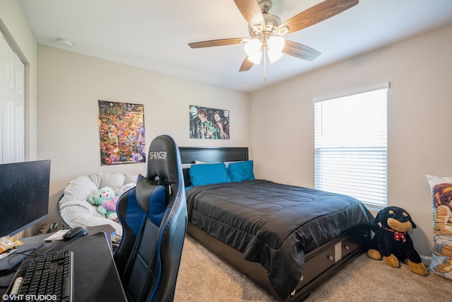 bedroom featuring ceiling fan and light carpet