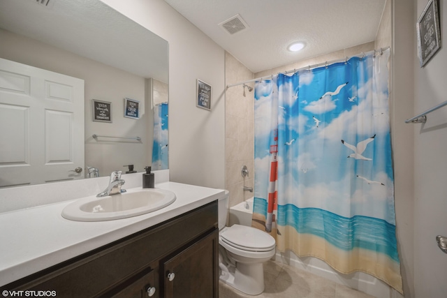 full bathroom featuring a textured ceiling, vanity, shower / bath combo, and toilet