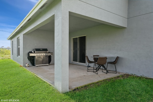 view of patio featuring a grill