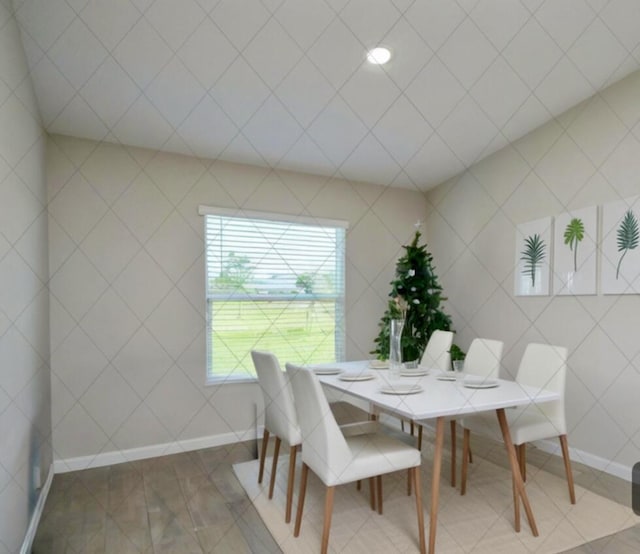 tiled dining area featuring tile walls