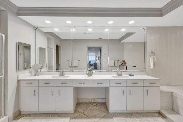 bathroom featuring walk in shower, vanity, and ornamental molding