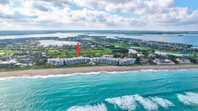 bird's eye view with a water view and a view of the beach