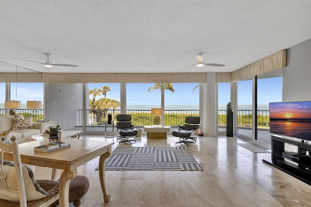 interior space featuring a textured ceiling and ceiling fan