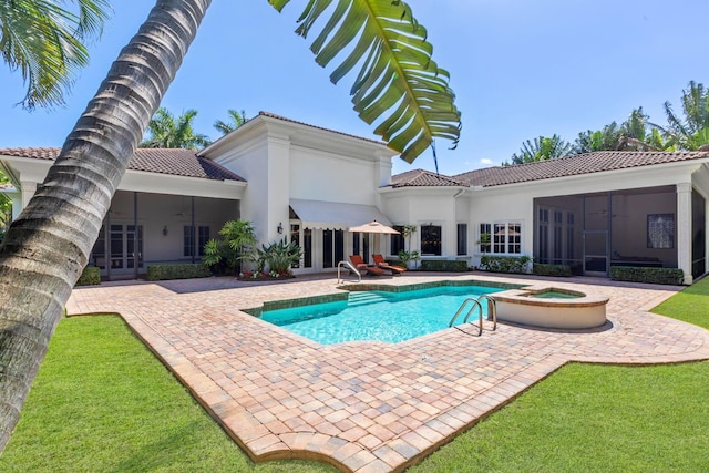 view of pool featuring an in ground hot tub, a patio, ceiling fan, and a sunroom