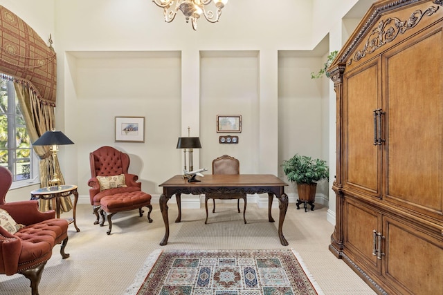 living area featuring light carpet and a chandelier