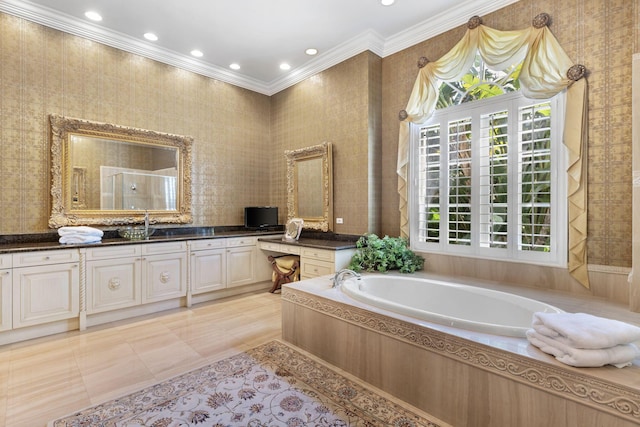 bathroom with tiled bath, vanity, and ornamental molding