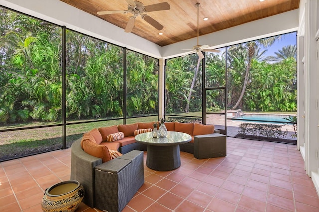 sunroom / solarium with a wealth of natural light, ceiling fan, and wood ceiling