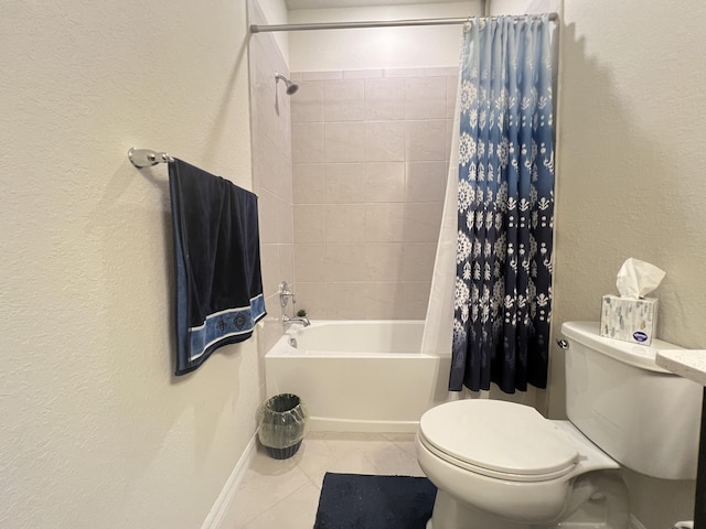 bathroom featuring tile patterned flooring, toilet, and shower / bath combo with shower curtain