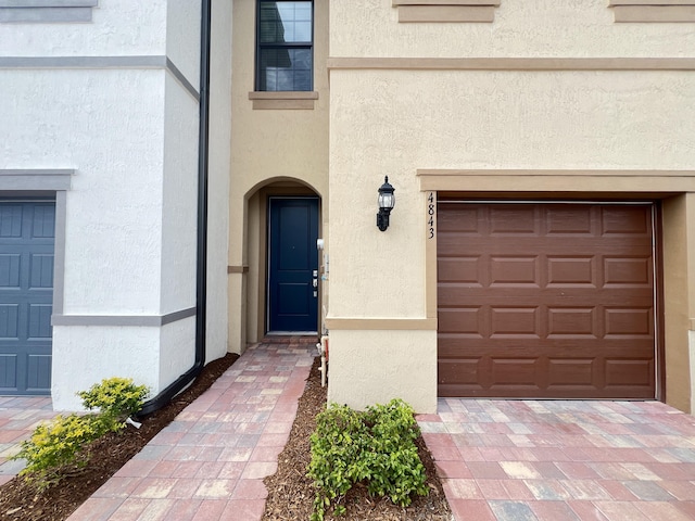 property entrance featuring a garage