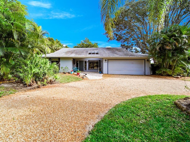 ranch-style home with a garage