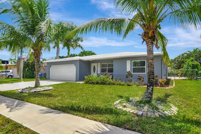 ranch-style home with a garage and a front lawn