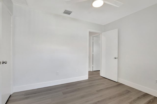 unfurnished room with ceiling fan and light hardwood / wood-style flooring