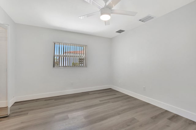 unfurnished room featuring light hardwood / wood-style floors and ceiling fan