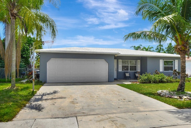 single story home featuring a front yard and a garage