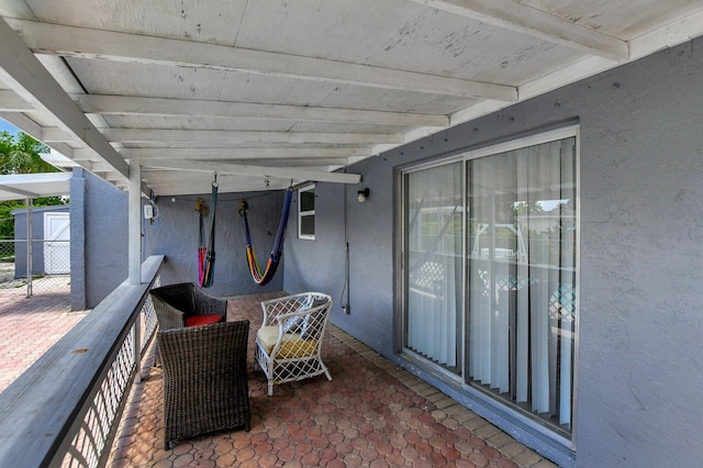 view of patio / terrace with a storage unit