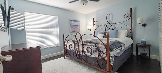 bedroom featuring multiple windows and ceiling fan