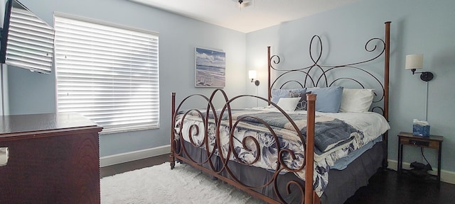 bedroom featuring multiple windows