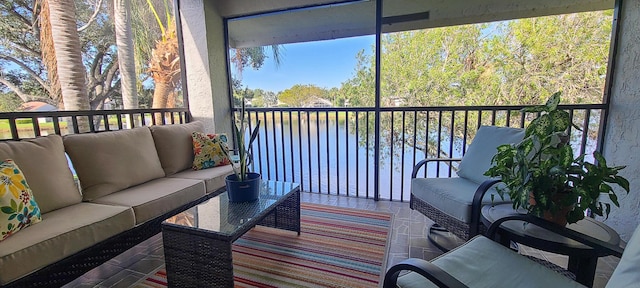 exterior space with an outdoor living space and a water view