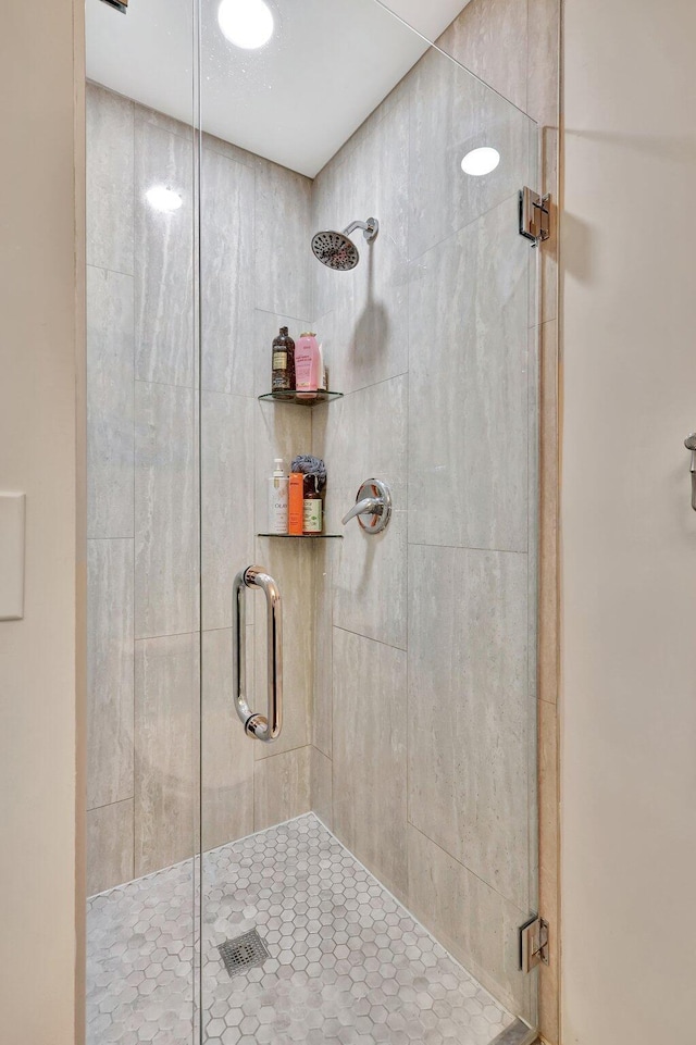 bathroom with a shower stall