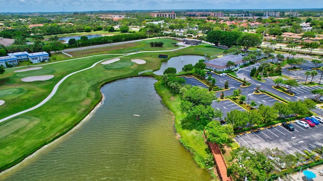 aerial view featuring view of golf course and a water view