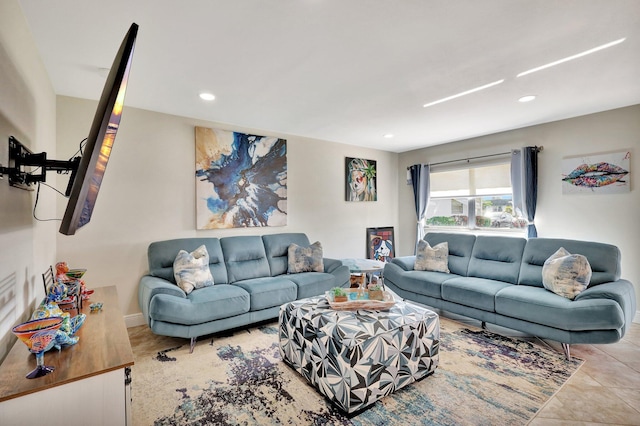 living area with tile patterned flooring and recessed lighting