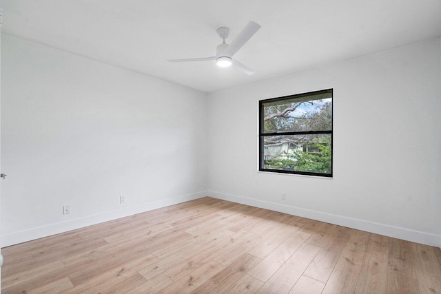 spare room featuring ceiling fan and light wood-type flooring