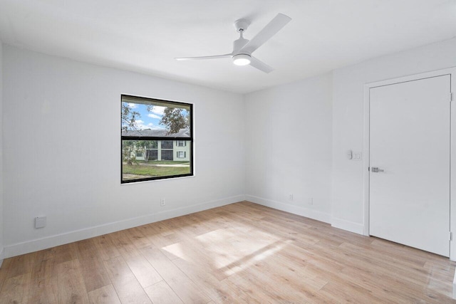 spare room with light hardwood / wood-style flooring and ceiling fan