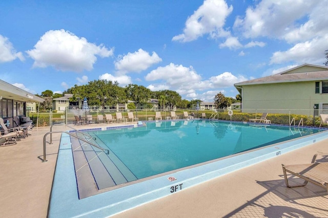 view of swimming pool featuring a patio