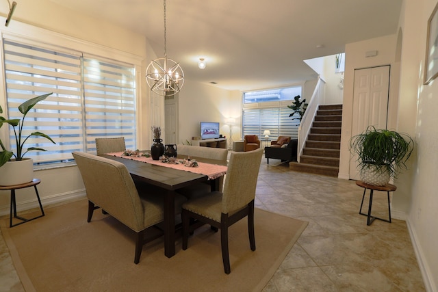 dining space with a notable chandelier